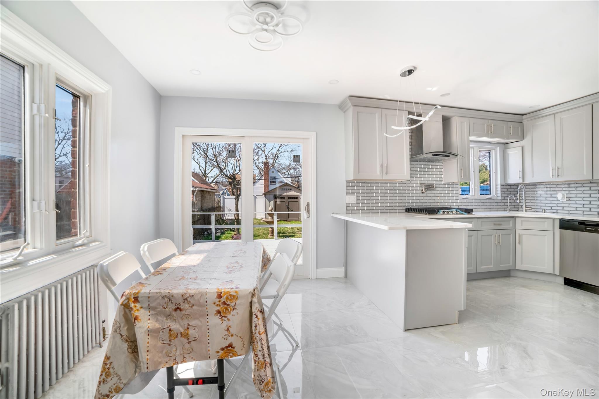 81-28 252nd Street Queens, NY 11426 - Photo 4 of 21 a kitchen that has a lot of cabinets in it with a sink