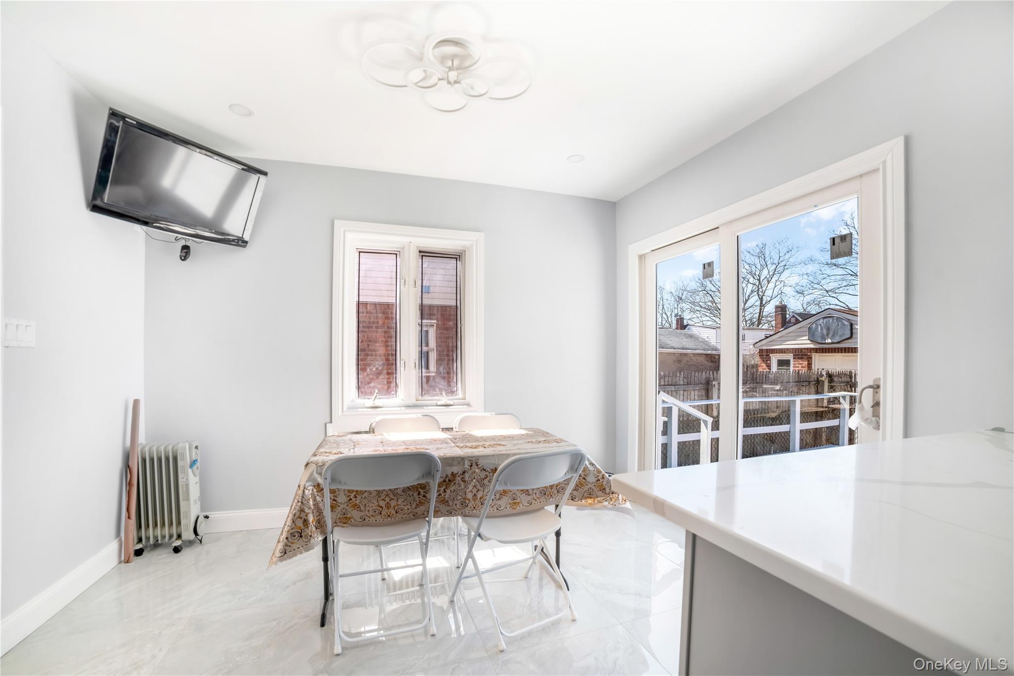 81-28 252nd Street Queens, NY 11426 - Photo 8 of 21 a dining room with furniture and window