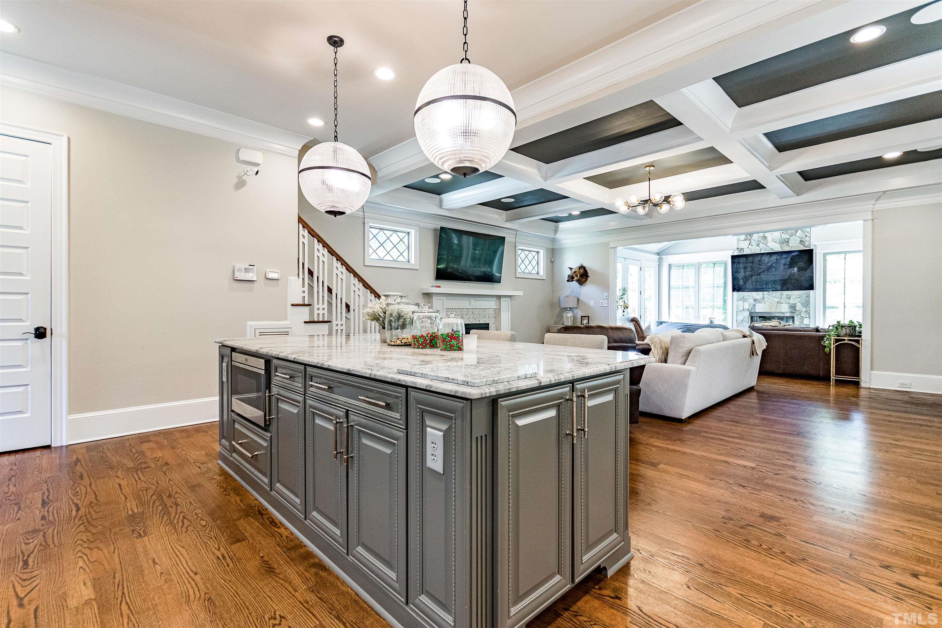 1928 Ridge Road Raleigh, NC 27607 - Photo 6 of 27 a view of living room with kitchen island furniture and wooden floor