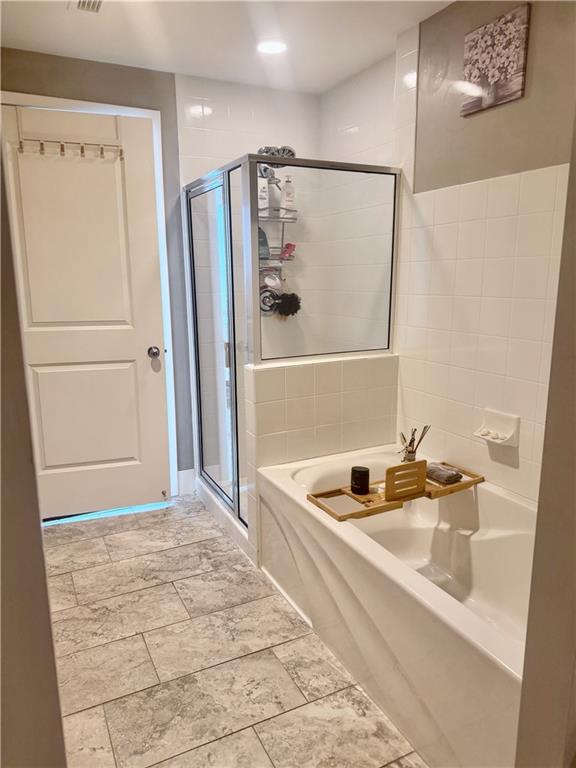 3338 Peachtree Road Northeast, Unit 2906 Atlanta, GA 30326 - Photo 16 of 27 a bathroom with a sink a shower and a mirror