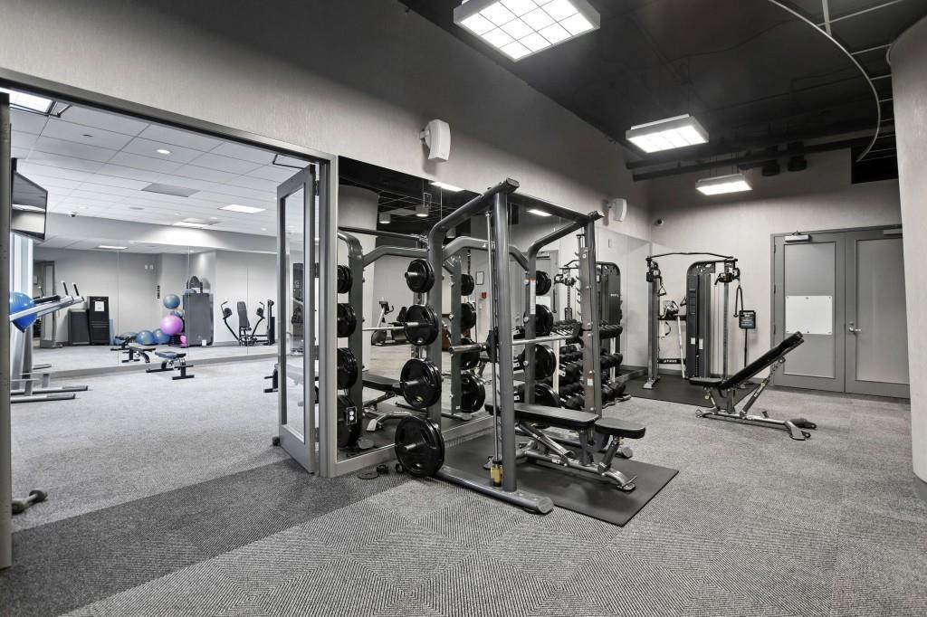 3338 Peachtree Road Northeast, Unit 2906 Atlanta, GA 30326 - Photo 25 of 27 a view of a room with gym equipment