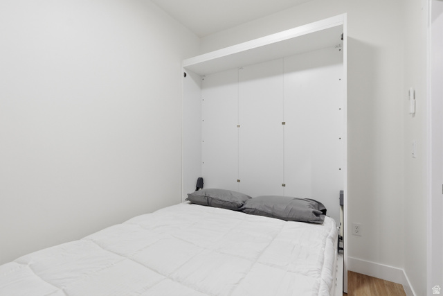 2085 North Main Street, Unit 107 Sunset, UT 84015 - Photo 10 of 21 Plus one by night room with wood finished floors and a closet
