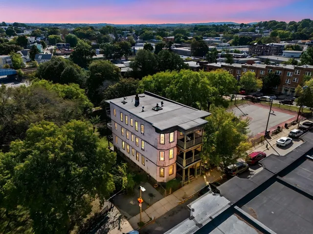 an aerial view of a house with a garden