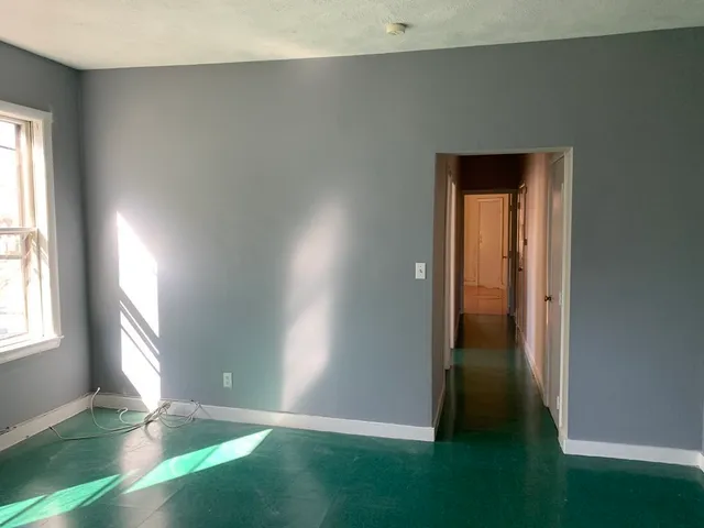 a view of an empty room and window