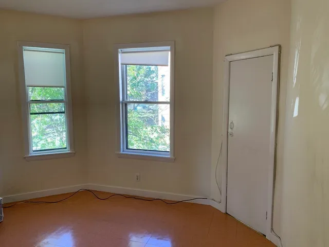 a view of room with window and bathroom