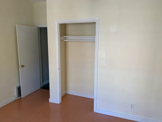 a bathroom with a shower and a sink
