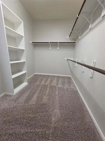 a view of an empty walk in closet