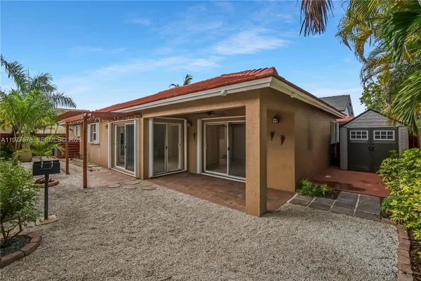 a view of house with door and outdoor space