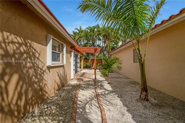 a house with a tree in front of it