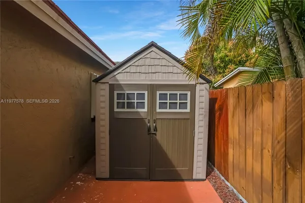 a view of outdoor space and front view of a house