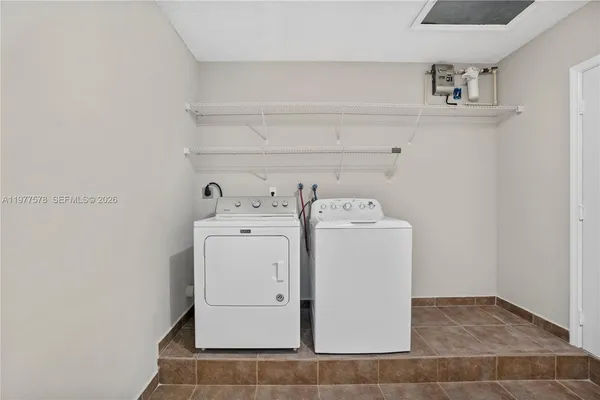 a utility room with dryer and washer