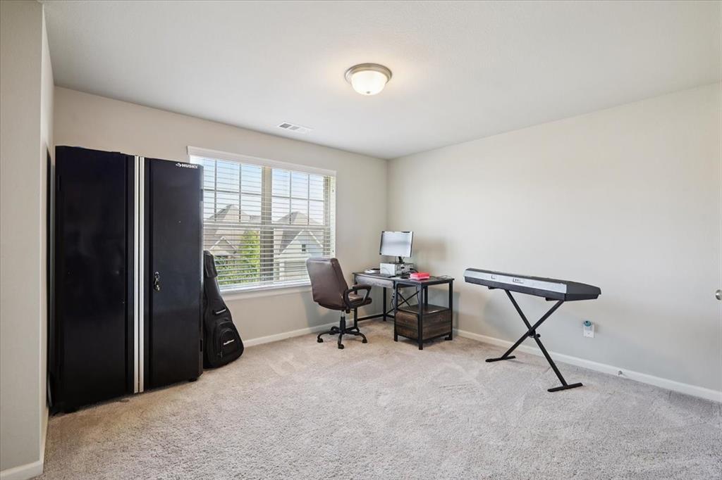 345 Greenbriar Road Little Elm, TX 75068 - Photo 17 of 20 Bedroom with light colored carpet.