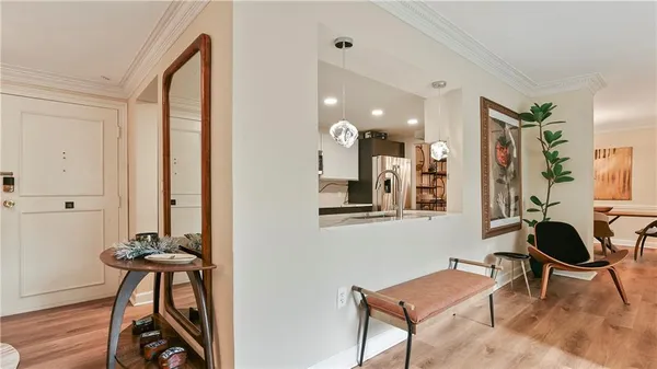 a view of a room with a table and chairs