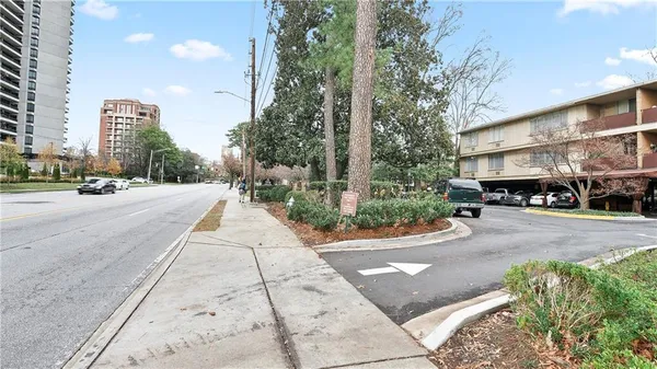 a view of a street with cars on road