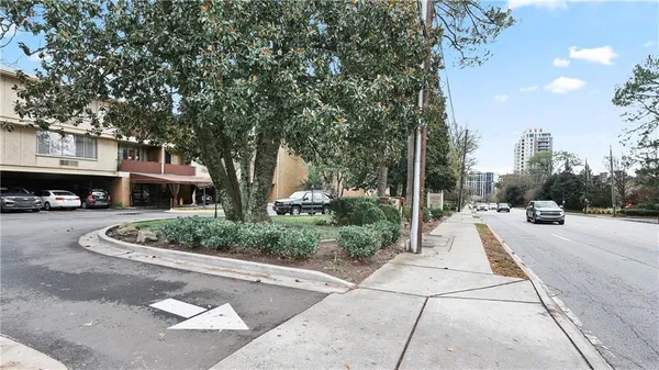a view of a chair and tables in the patio