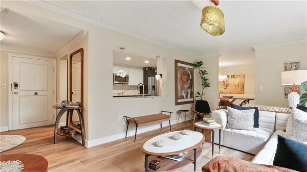 a living room with furniture a dining table and a fireplace