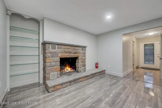 a kitchen with stainless steel appliances kitchen island granite countertop a stove a sink and a microwave