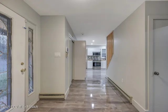 a kitchen with stainless steel appliances kitchen island granite countertop a stove and a sink