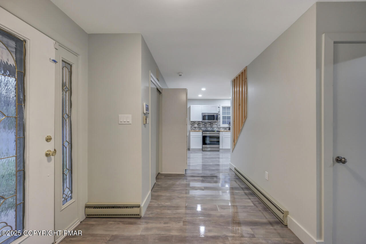 384 Devils Hole Road Cresco, PA 18326 - Photo 14 of 97 a view of a hallway with wooden floor and staircase