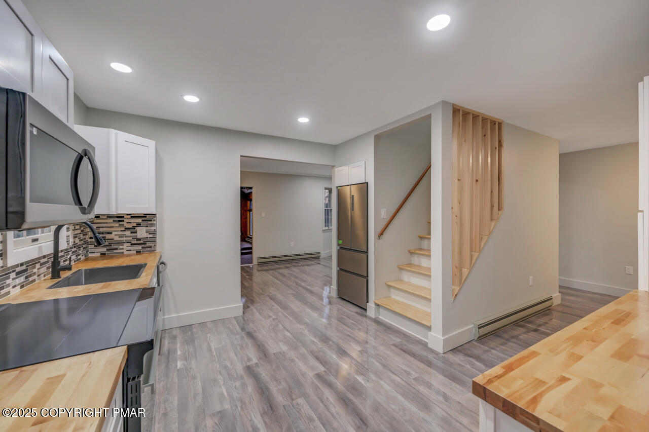 384 Devils Hole Road Cresco, PA 18326 - Photo 19 of 97 a view of hallway with wooden floor and stairs