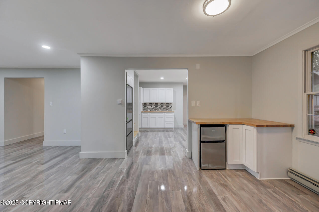 384 Devils Hole Road Cresco, PA 18326 - Photo 26 of 97 a view of a room with wooden floor and brick wall
