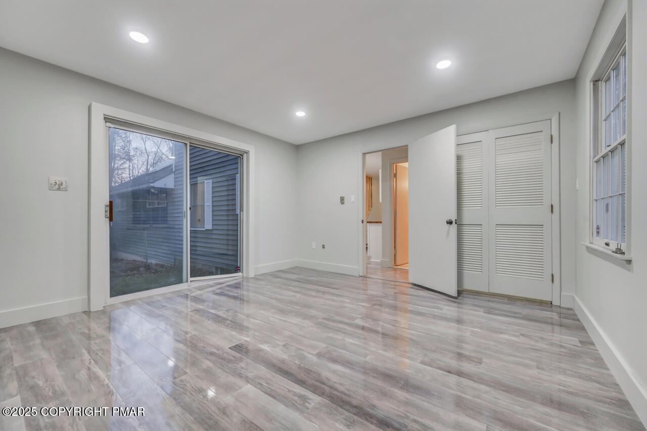 384 Devils Hole Road Cresco, PA 18326 - Photo 40 of 97 a view of an empty room with wooden floor and a window