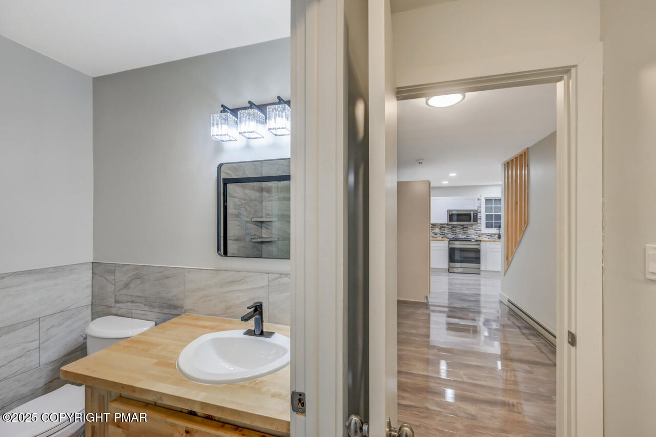 384 Devils Hole Road Cresco, PA 18326 - Photo 42 of 97 a bathroom with a sink and a mirror