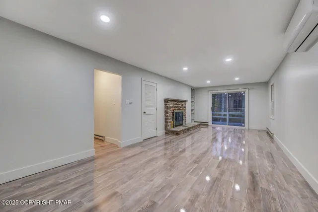 a view of a roof deck with wooden floor and fence