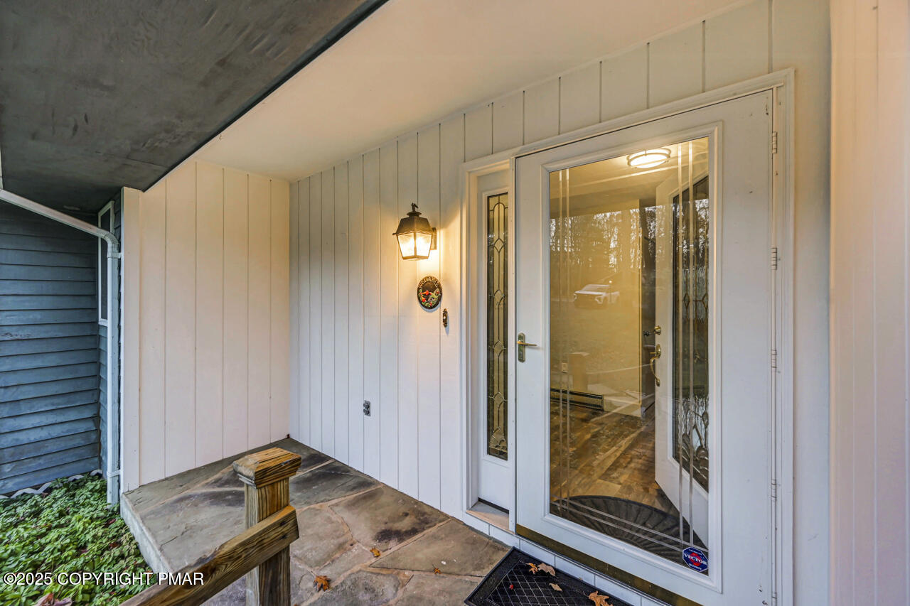 384 Devils Hole Road Cresco, PA 18326 - Photo 5 of 97 a view of a hallway with wooden floor and a bathroom