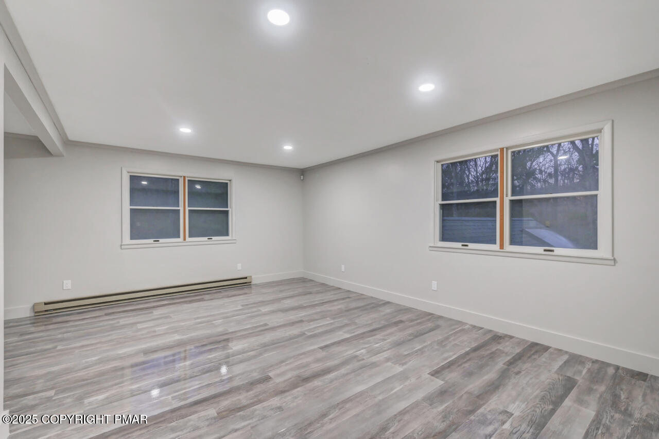 384 Devils Hole Road Cresco, PA 18326 - Photo 57 of 97 a view of an empty room with a window and wooden floor