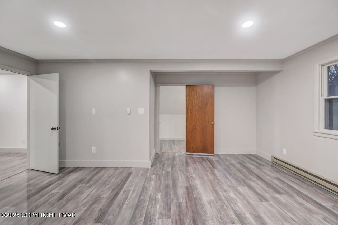 384 Devils Hole Road Cresco, PA 18326 - Photo 60 of 97 wooden floor in an empty room with a window