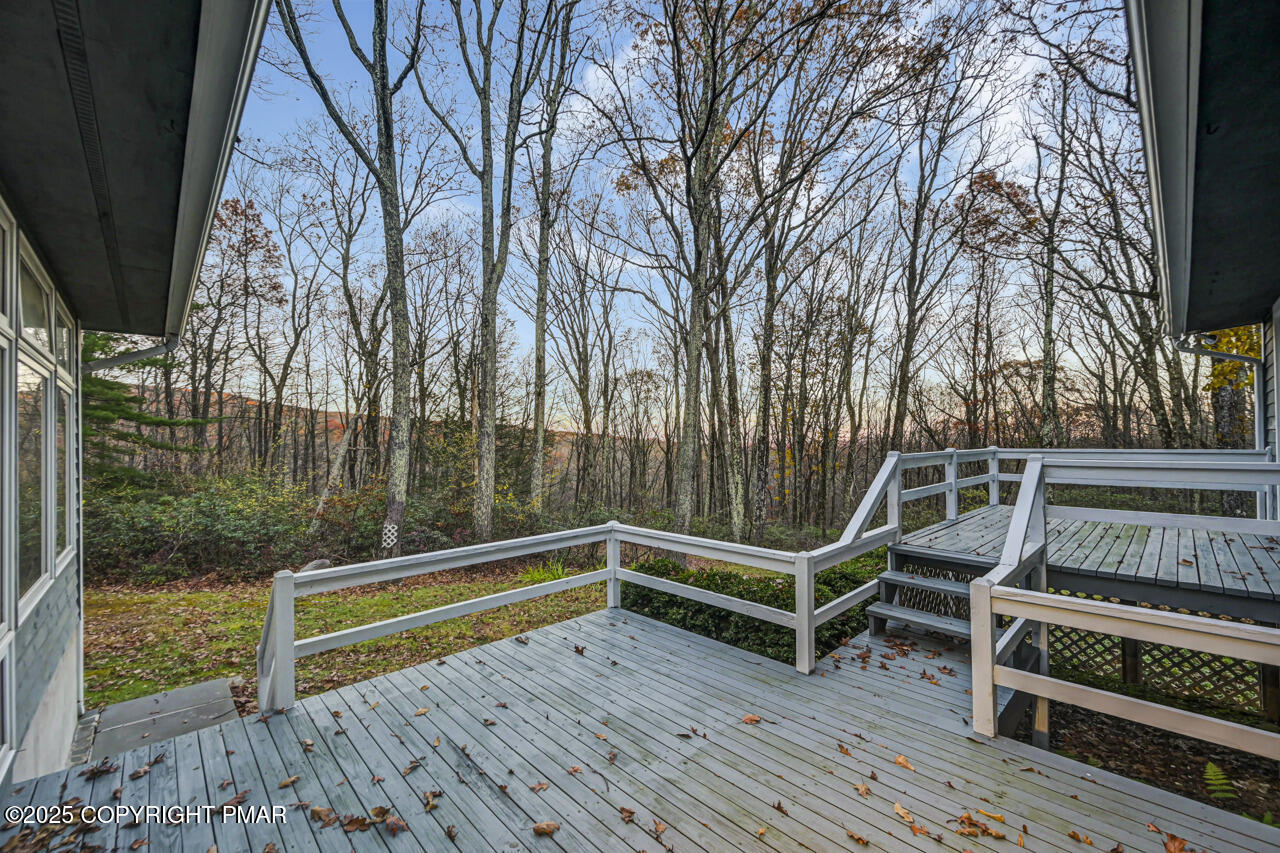 384 Devils Hole Road Cresco, PA 18326 - Photo 82 of 97 a view of a roof deck with wooden floor and fence