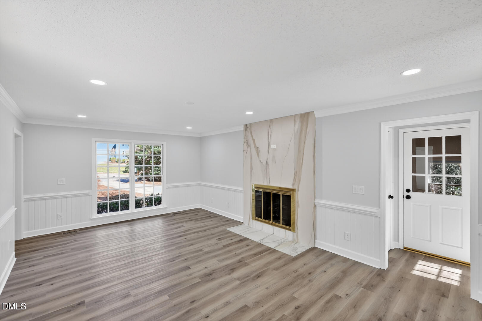 2224 Effingham Circle Raleigh, NC 27615 - Photo 13 of 51 a view of empty room with wooden floor and fireplace