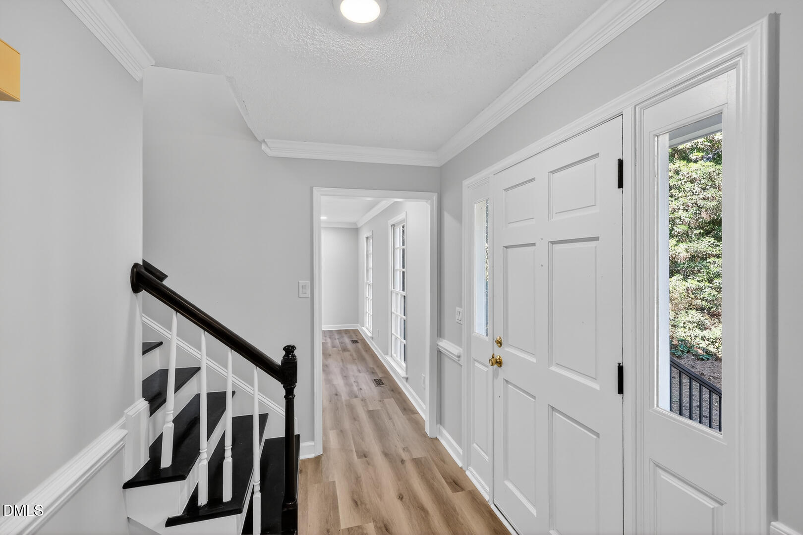2224 Effingham Circle Raleigh, NC 27615 - Photo 16 of 51 a view of a hallway with wooden floor and staircase