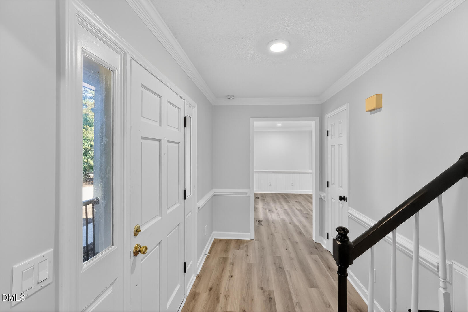 2224 Effingham Circle Raleigh, NC 27615 - Photo 17 of 51 a view of a hallway with wooden floor and staircase