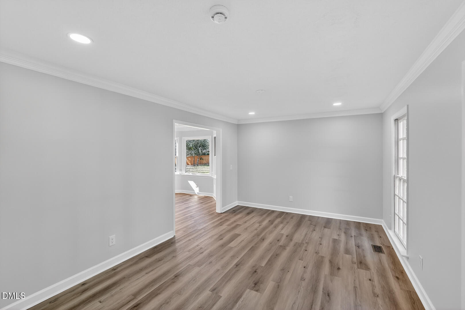 2224 Effingham Circle Raleigh, NC 27615 - Photo 18 of 51 a view of an empty room with wooden floor