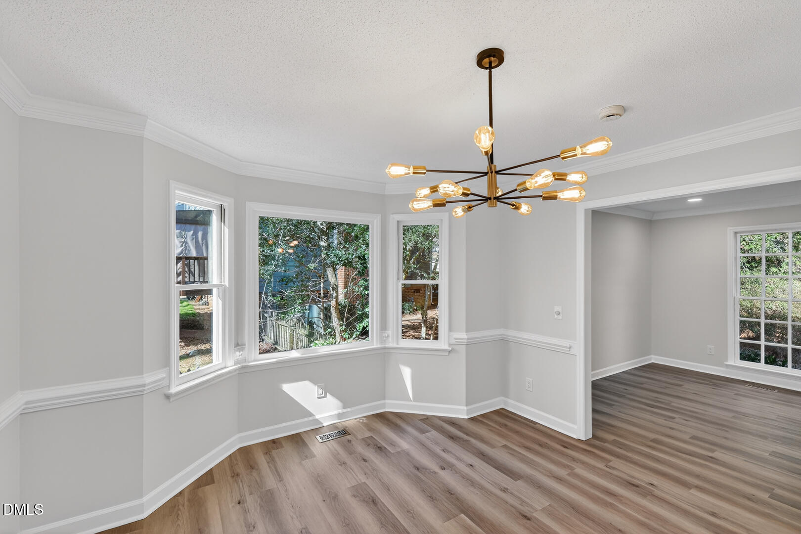 2224 Effingham Circle Raleigh, NC 27615 - Photo 20 of 51 a view of empty room with wooden floor and fan