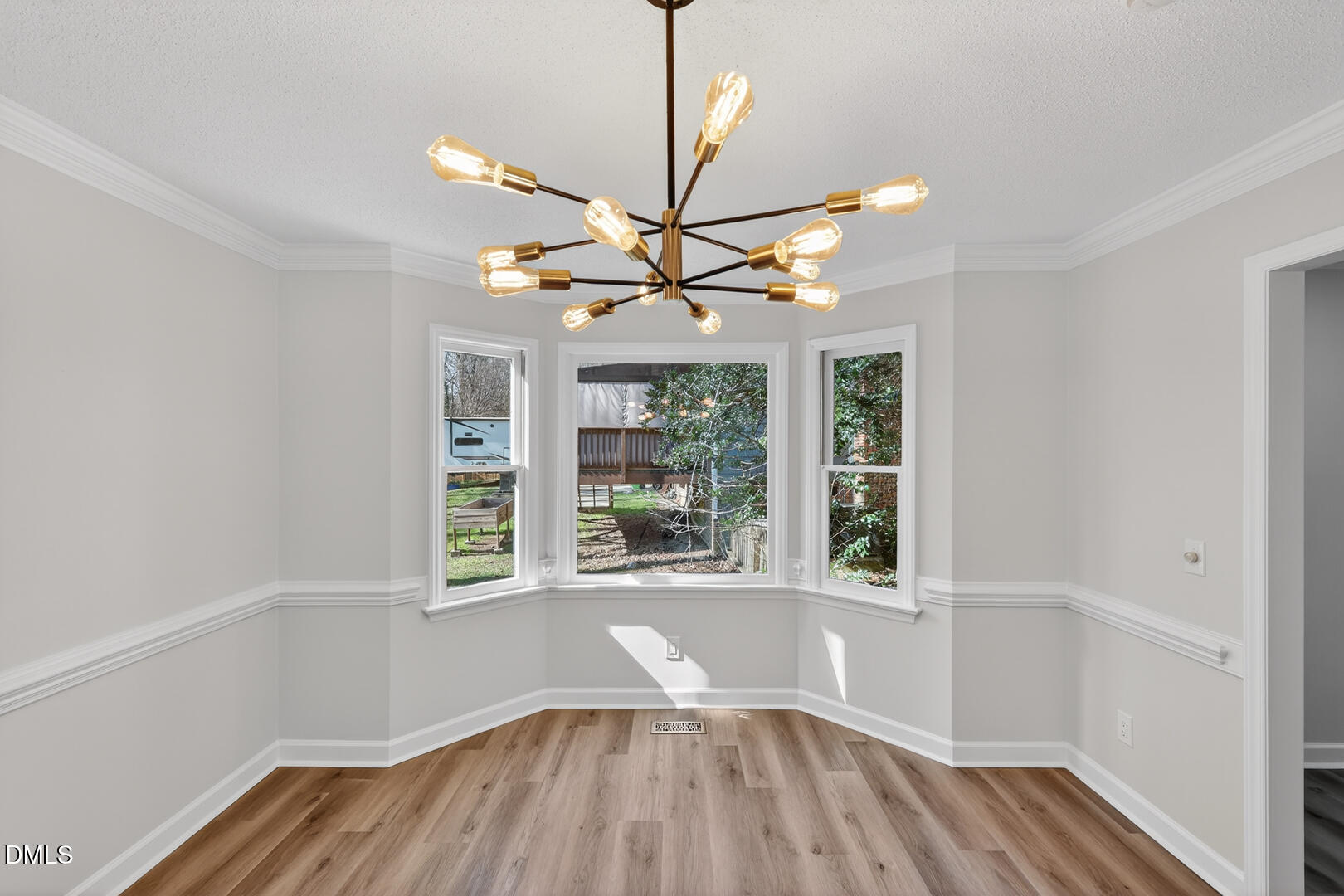2224 Effingham Circle Raleigh, NC 27615 - Photo 21 of 51 a view of a livingroom with a window and wooden floor