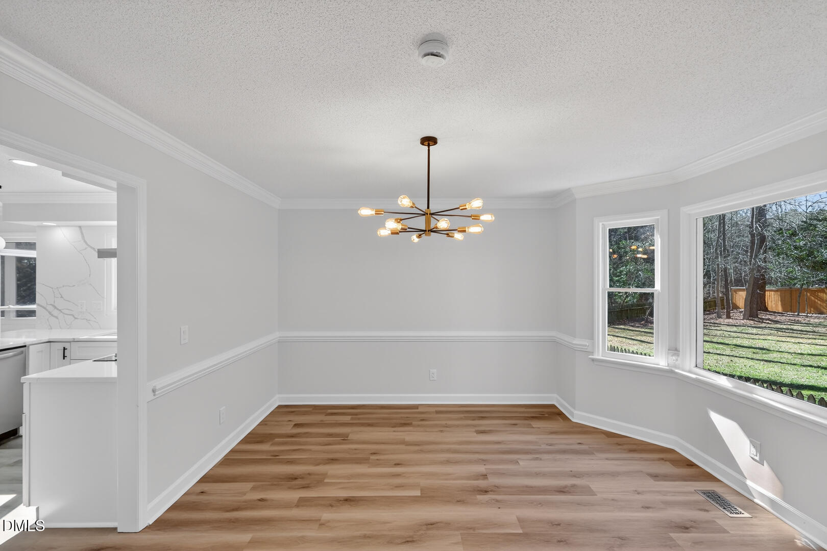2224 Effingham Circle Raleigh, NC 27615 - Photo 23 of 51 a view of empty room with wooden floor and window
