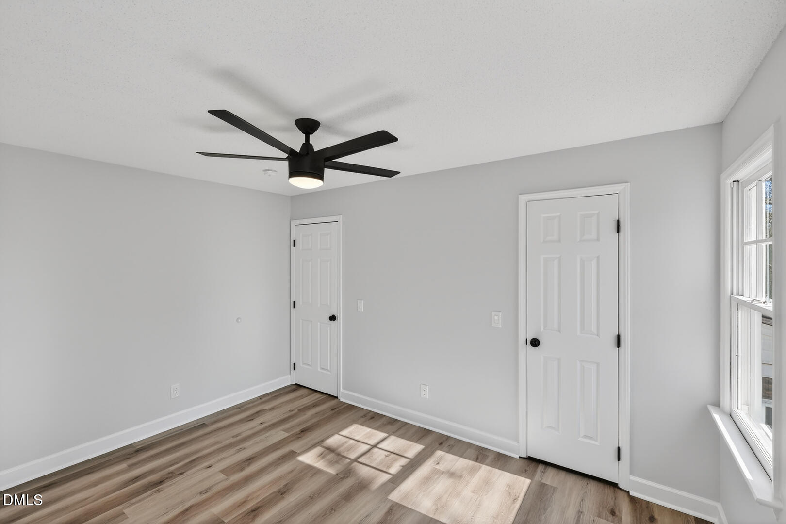 2224 Effingham Circle Raleigh, NC 27615 - Photo 25 of 51 a view of empty room with wooden floor and ceiling fan