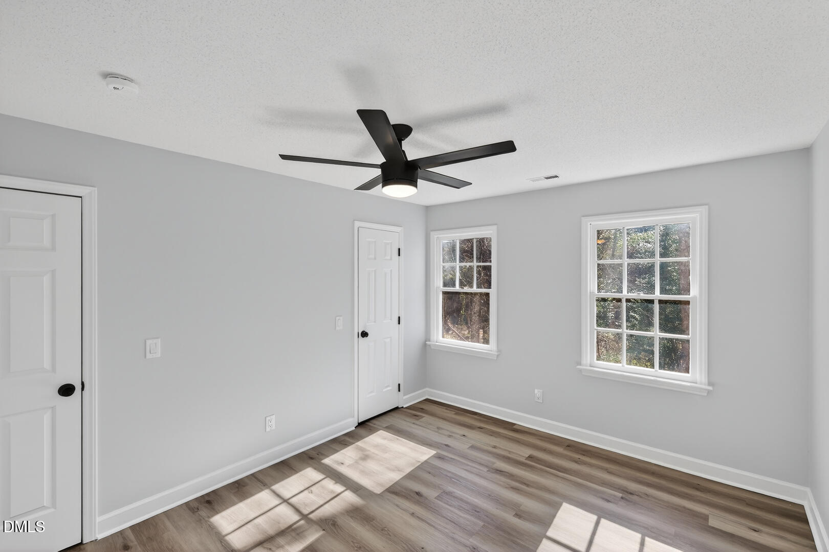 2224 Effingham Circle Raleigh, NC 27615 - Photo 26 of 51 a view of empty room with wooden floor and ceiling fan