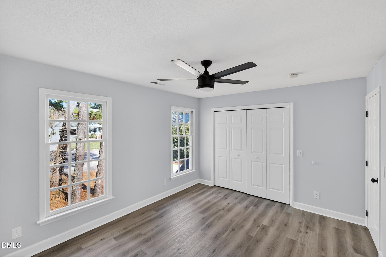 2224 Effingham Circle Raleigh, NC 27615 - Photo 29 of 51 a view of a livingroom with a ceiling fan and wooden floor