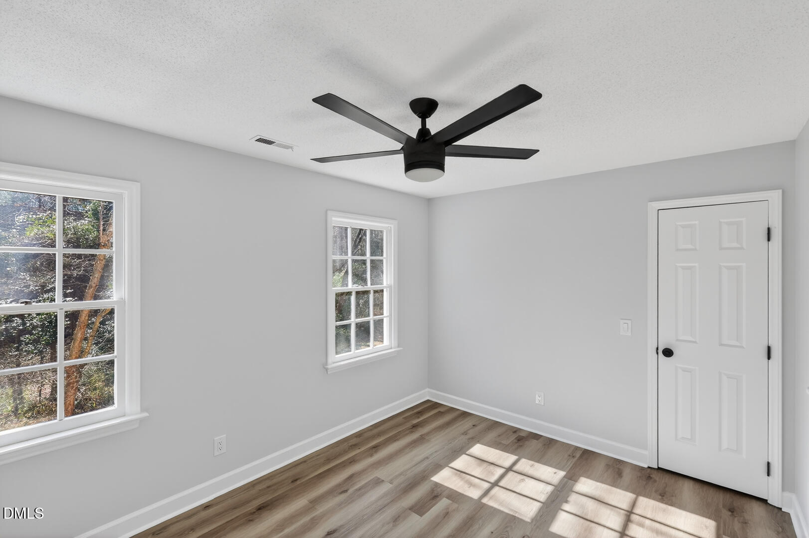 2224 Effingham Circle Raleigh, NC 27615 - Photo 33 of 51 a view of empty room with window and ceiling fan