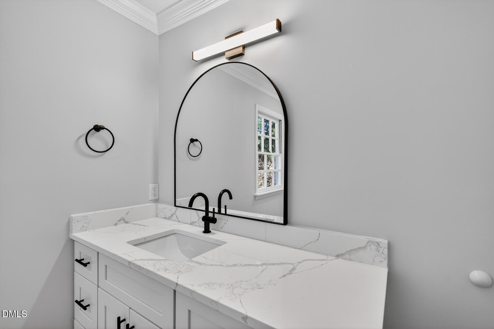 2224 Effingham Circle Raleigh, NC 27615 - Photo 35 of 51 a bathroom with a sink and mirror