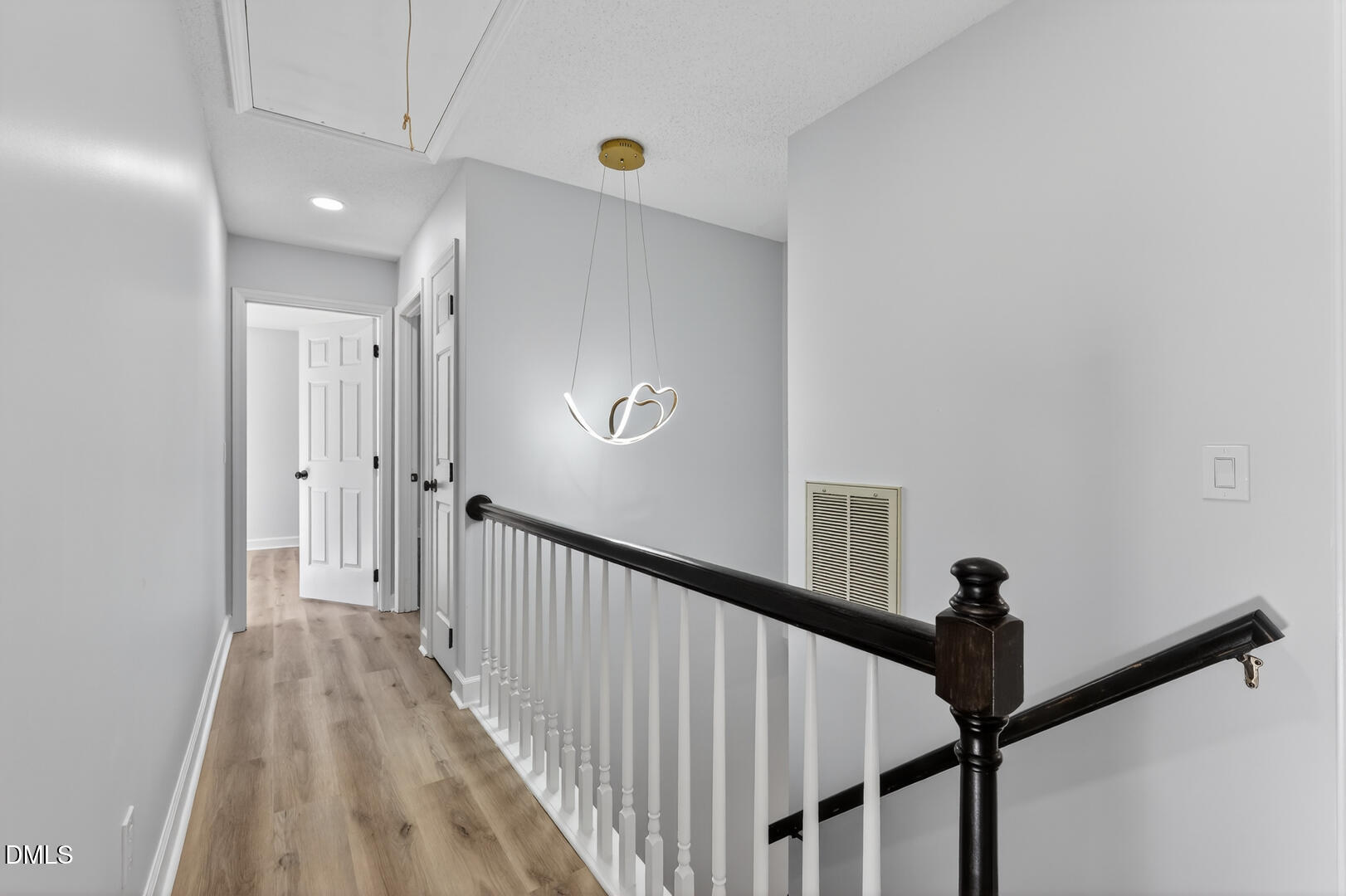 2224 Effingham Circle Raleigh, NC 27615 - Photo 36 of 51 a view of a hallway with wooden floor and staircase