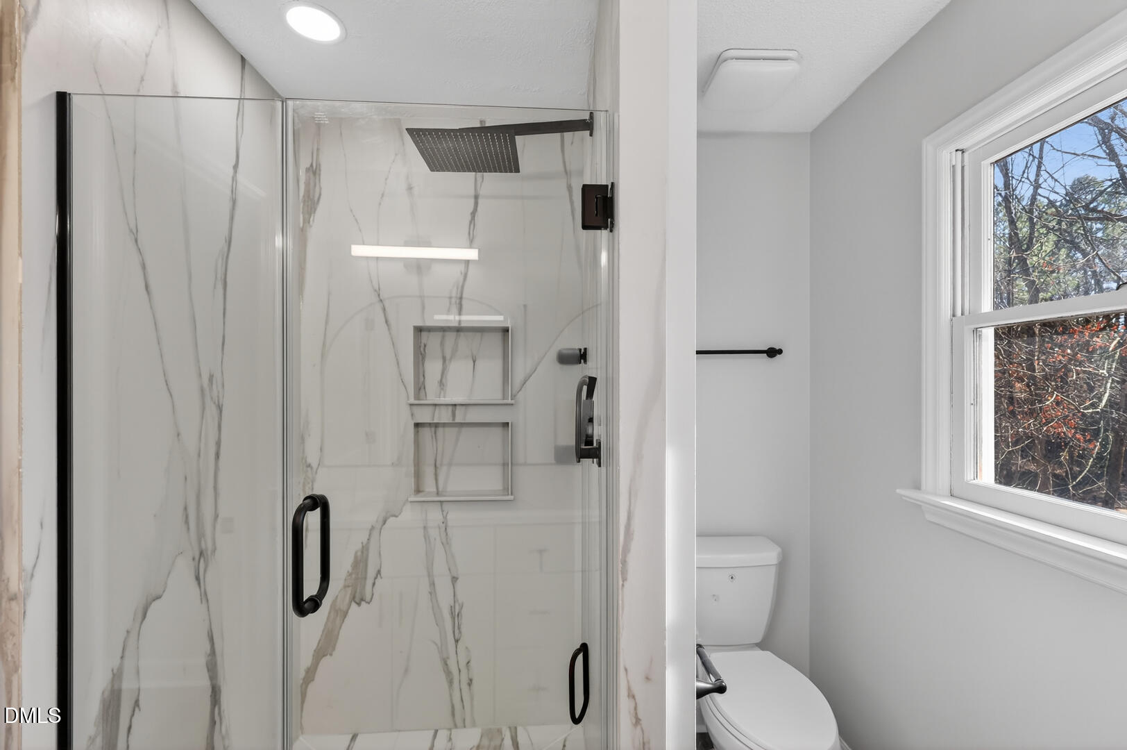 2224 Effingham Circle Raleigh, NC 27615 - Photo 37 of 51 a bathroom with a toilet and a shower