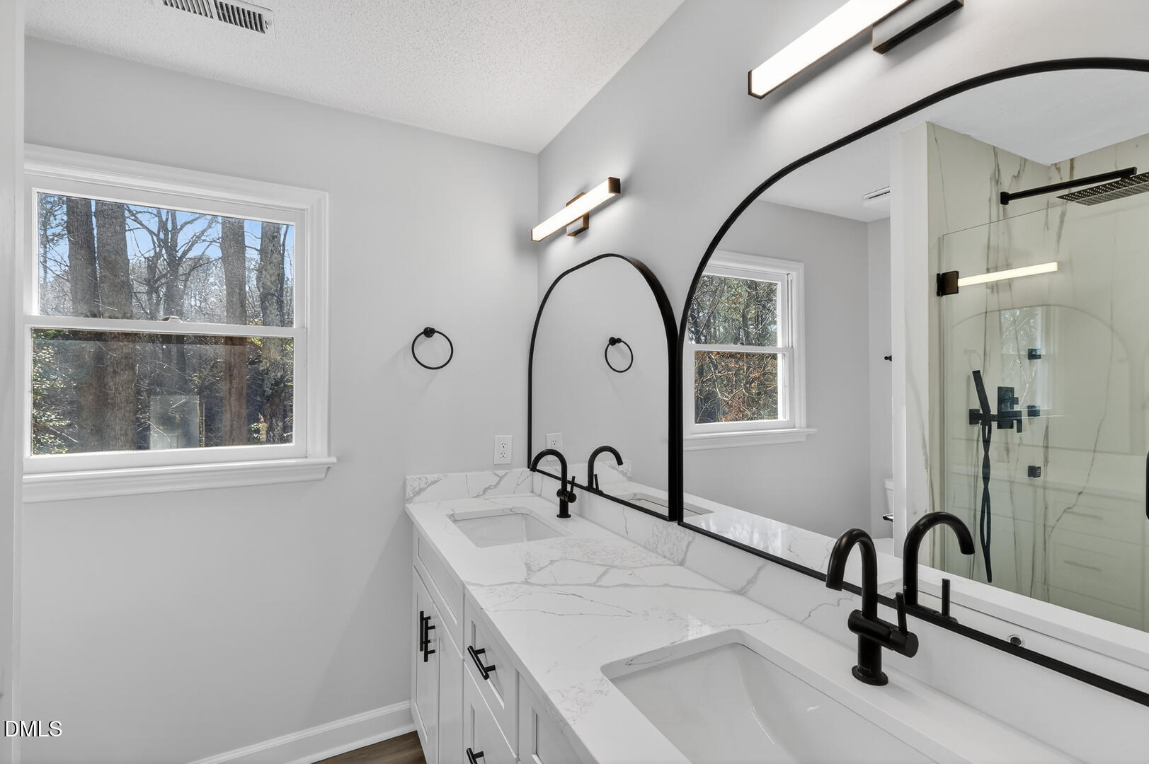 2224 Effingham Circle Raleigh, NC 27615 - Photo 39 of 51 a bathroom with a sink and a mirror