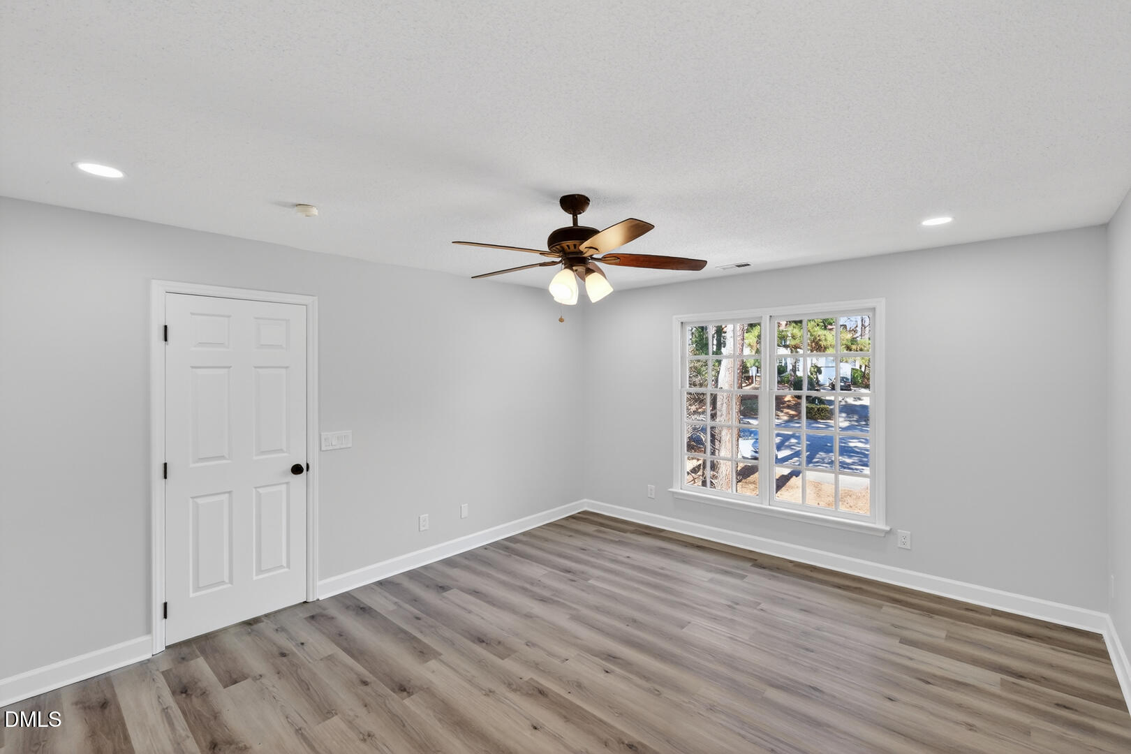 2224 Effingham Circle Raleigh, NC 27615 - Photo 42 of 51 wooden floor in an empty room with a window