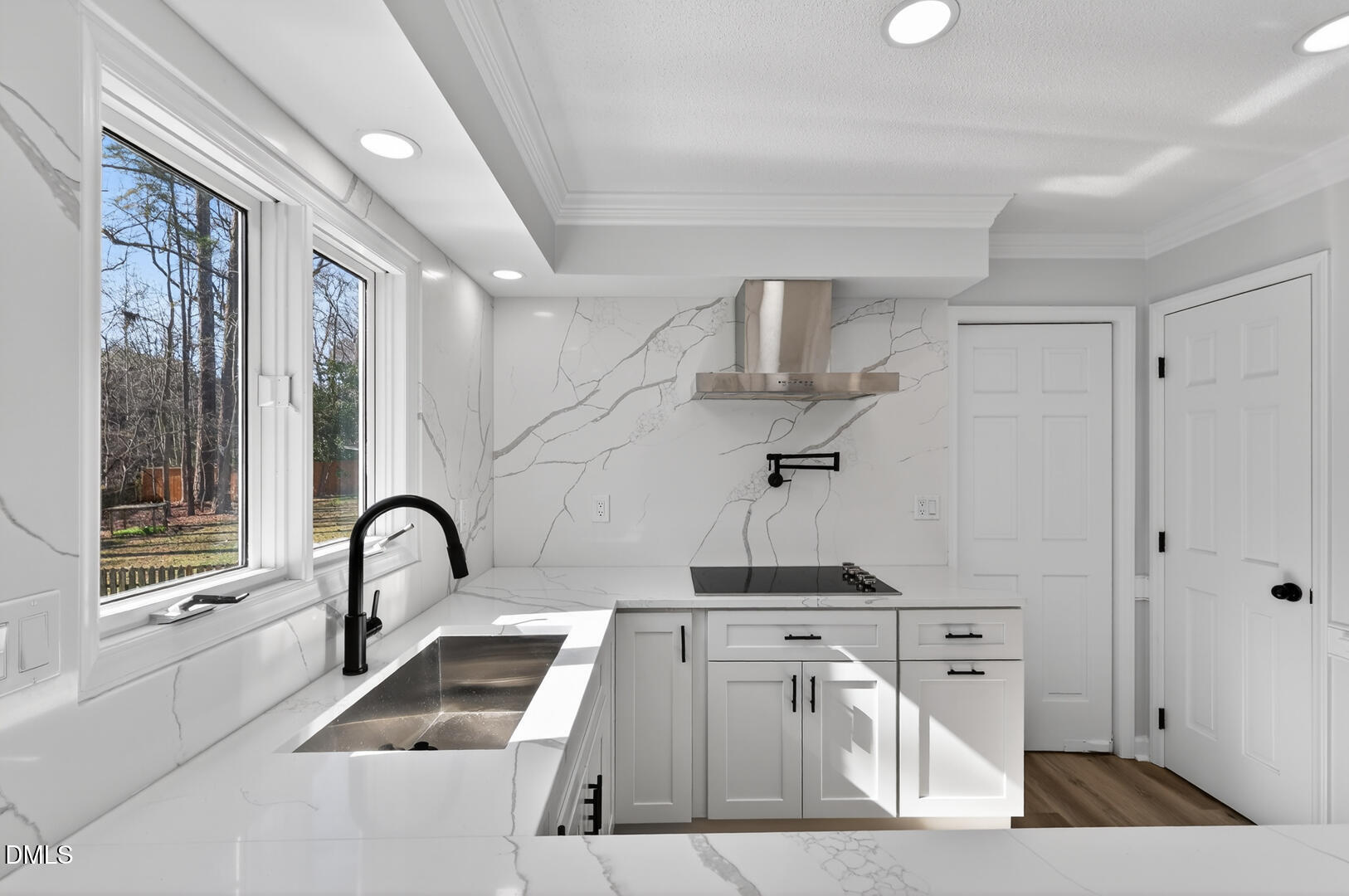 2224 Effingham Circle Raleigh, NC 27615 - Photo 6 of 51 a view of a kitchen with a sink and windows