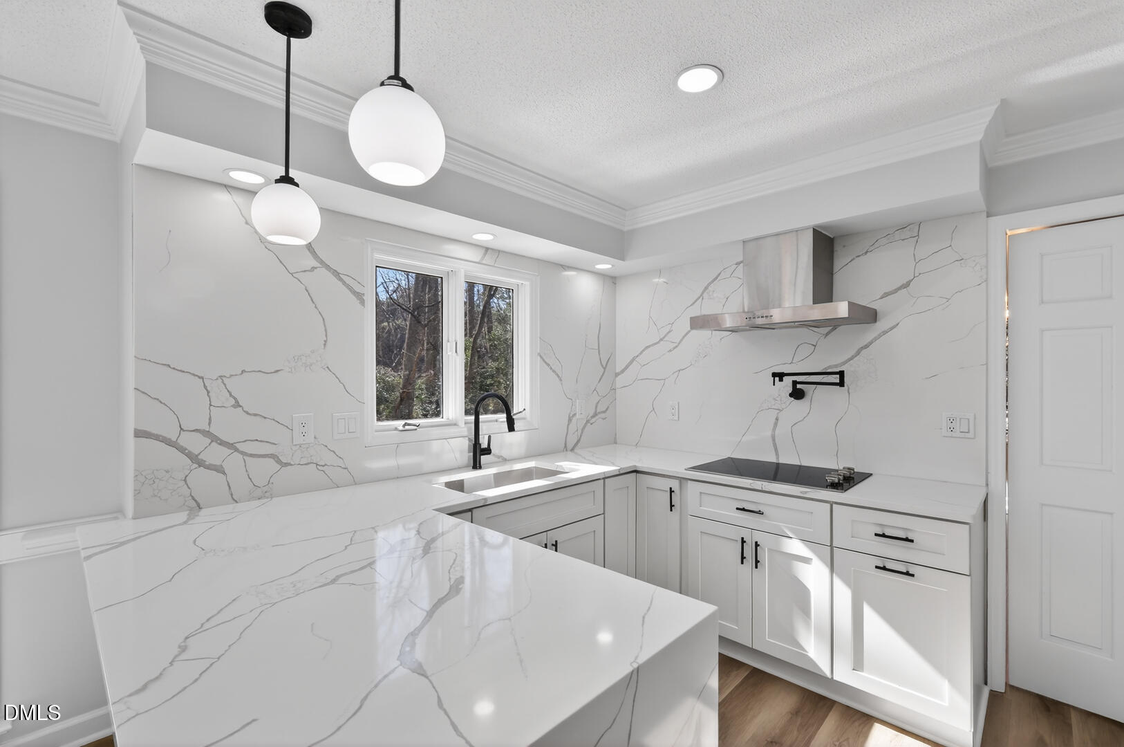 2224 Effingham Circle Raleigh, NC 27615 - Photo 8 of 51 a kitchen with a sink dishwasher and white cabinets with wooden floor